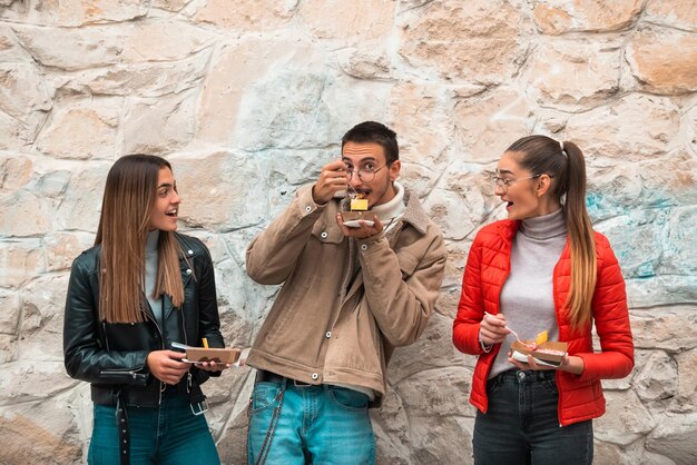 group students take break from college rest talk eat delicious sweetsselective focus 597987 2238 1